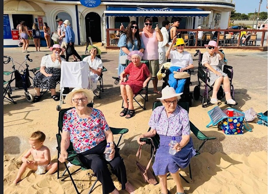 residents and staff down the local beach