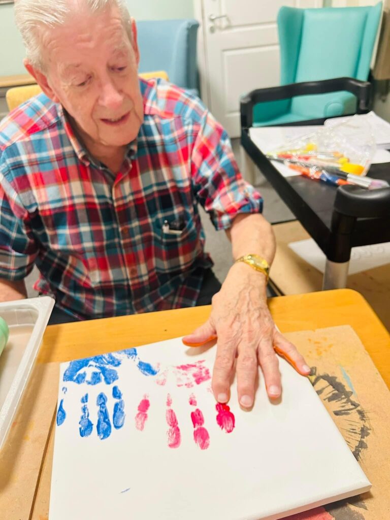 resident painting with his hands