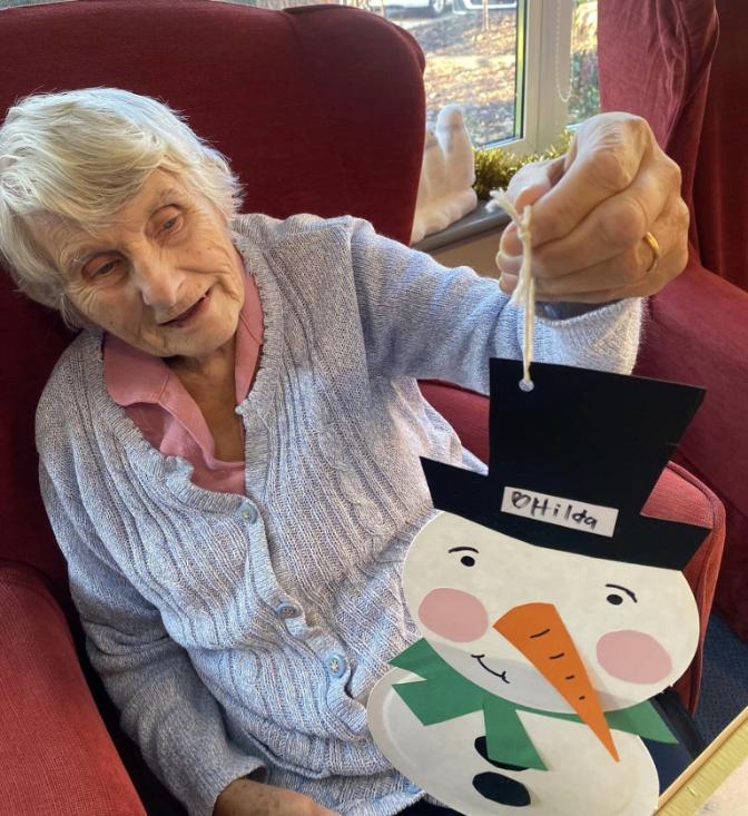 resident with their snowman arts and crafts