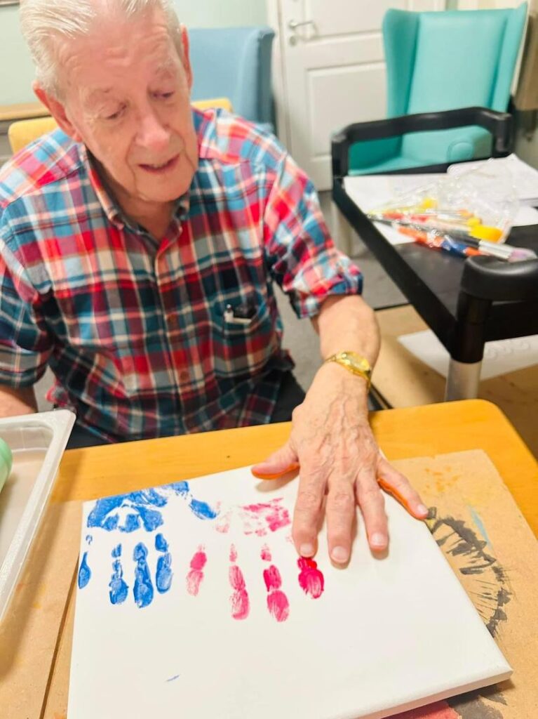 resident painting with his hands