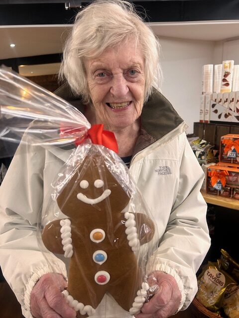 one of our residents with a giant gingerbread man