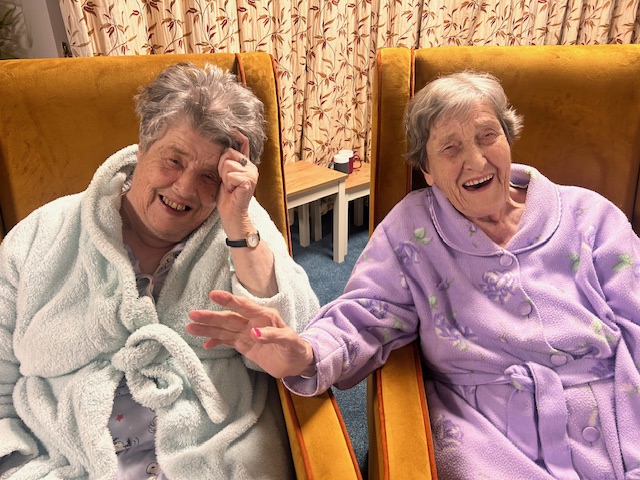 residents sitting in their cosy clothes together