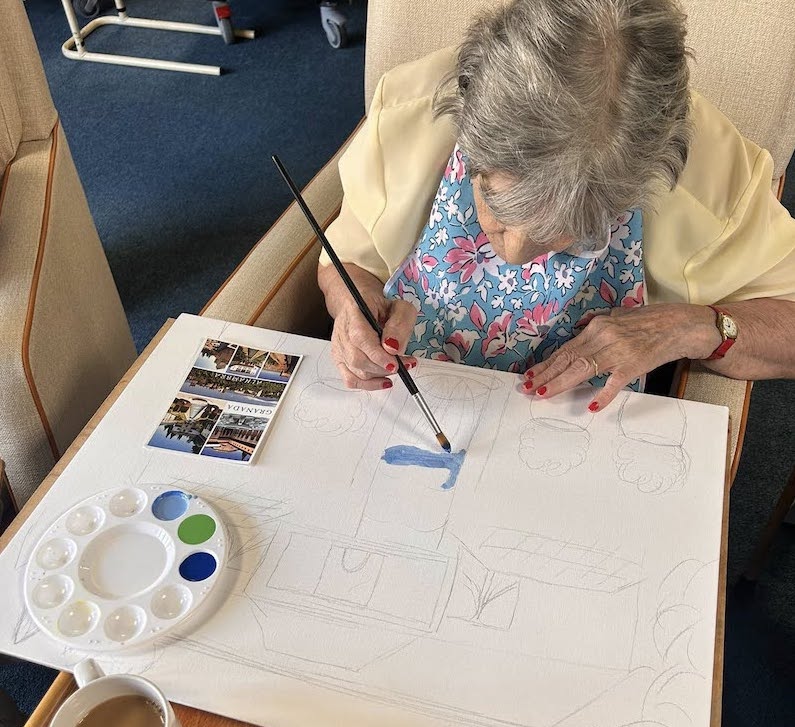 resident painting on a canvas