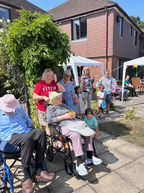 residents together in the sun at our garden party