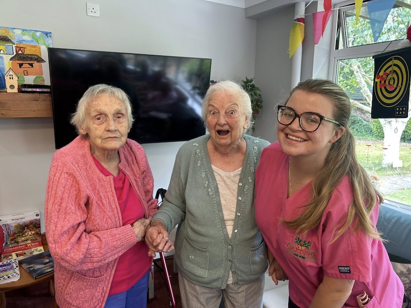 group photo of residents and one of our team