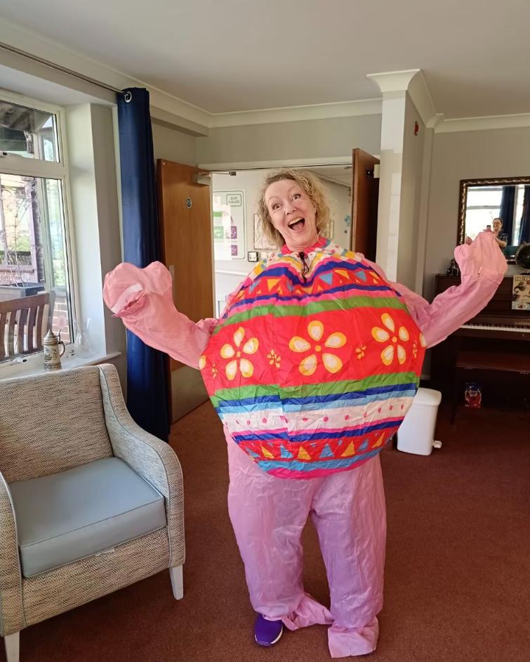 lady in an easter costume smiling